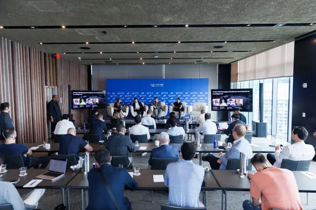 The full conference room during a stage panel