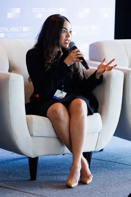 A speaker making her point from the fireside chair